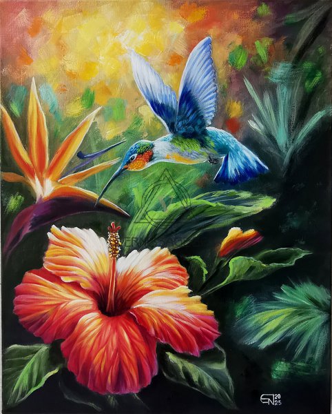 Колибри над цветком